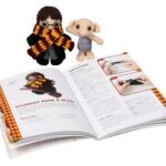 Finished Harry and Dobby crochet dolls beside the open Harry Potter Crochet instruction book